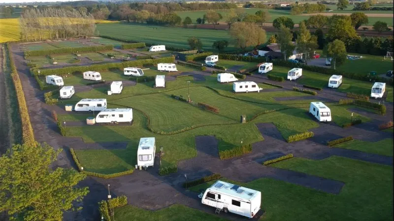 Aerial view across the site and the surrounding countryside